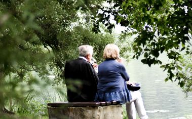 Old couple near lake